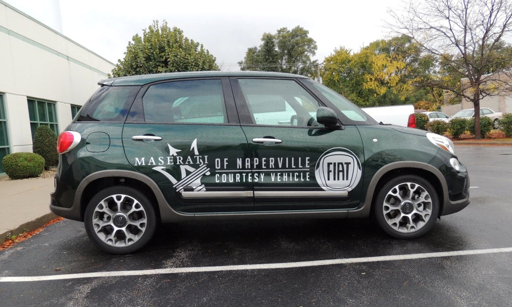 Cast vinyl lettering on a small vehicle