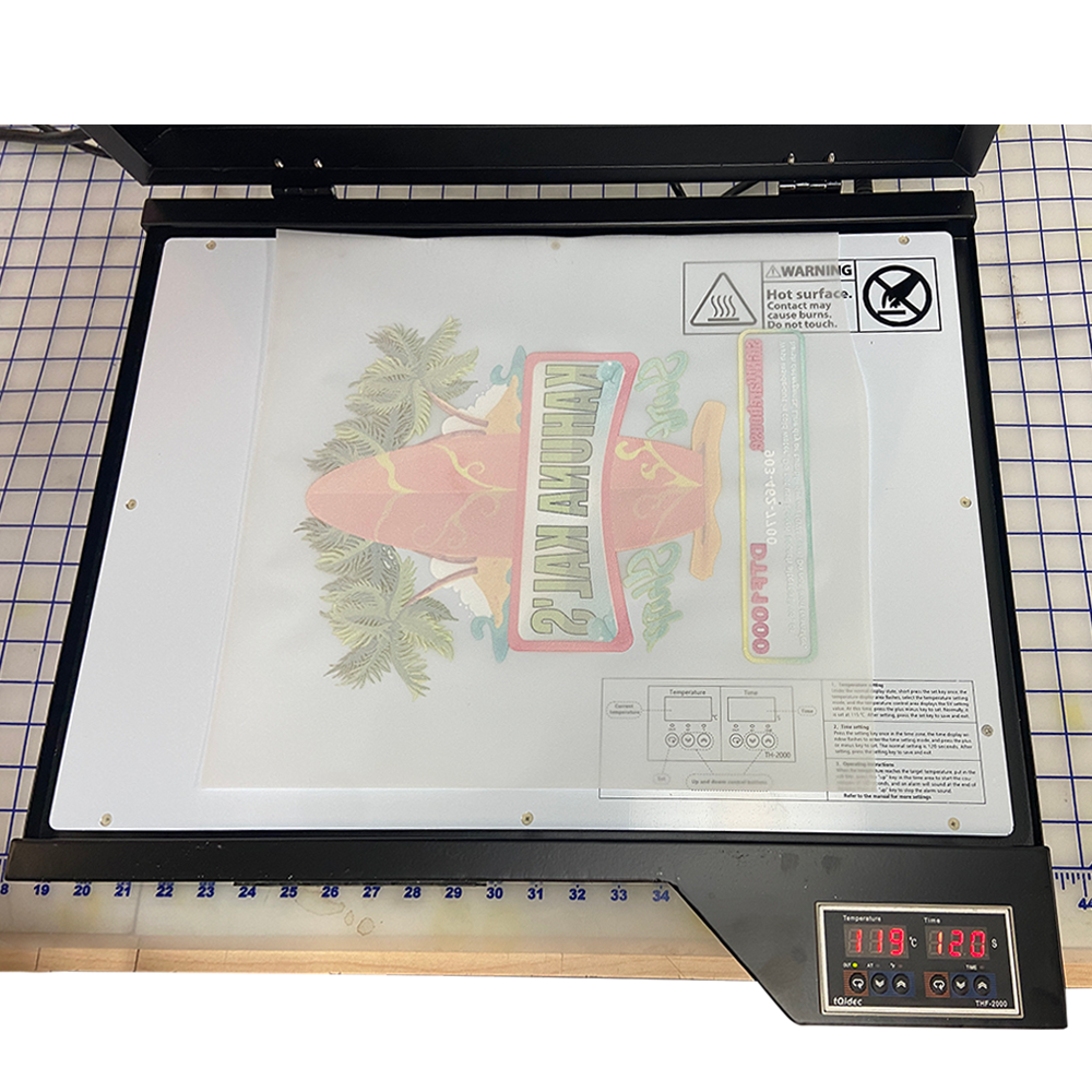DTF Process: Step three. place print in DTF heat station